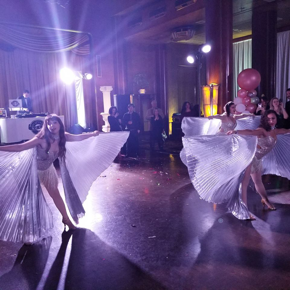 three jazz dancers with vegas wings